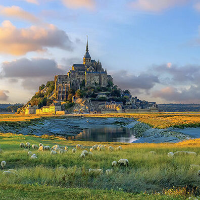 Famous Le Mont Saint-Michel tidal island in Normandy, northern France at sunset